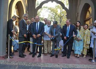 Mr. Iftikhar H. Shirazi cutting the ribbon along with (R)Mr.Mohsin Leghari,(L) Mr.Michael A.Thomson (College Principal) and guests.