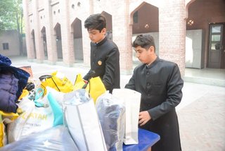Prep School Boys collecting things for flood refugees