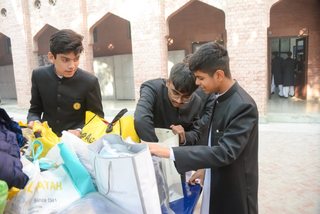 Prep School Boys collecting things for flood refugees