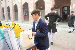 Prep School Boys collecting things for flood refugees