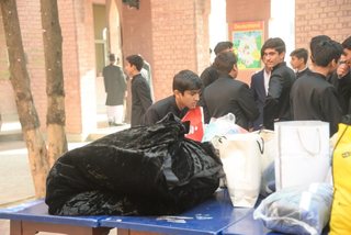 Prep School Boys collecting things for flood refugees