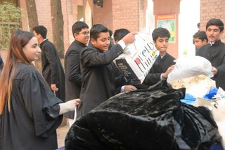 Prep School Boys collecting things for flood refugees
