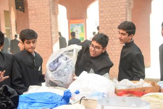 Prep School Boys collecting things for flood refugees