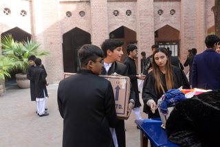 Prep School Boys collecting things for flood refugees