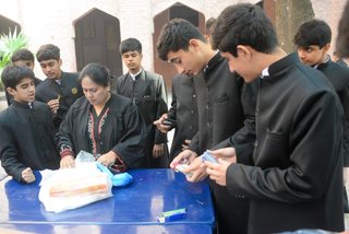 Prep School Boys collecting things for flood refugees