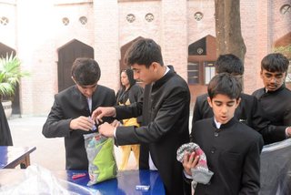 Prep School Boys collecting things for flood refugees