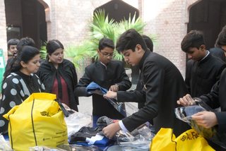 Prep School Boys collecting things for flood refugees