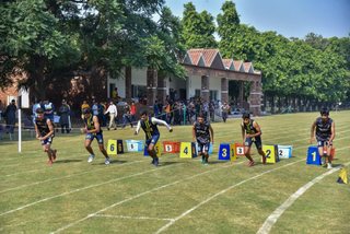 Aitchison Dominates First Day's Athletics Against Lawrence