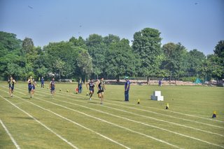 Aitchison Dominates First Day's Athletics Against Lawrence