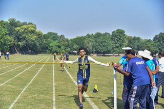 Aitchison Dominates First Day's Athletics Against Lawrence