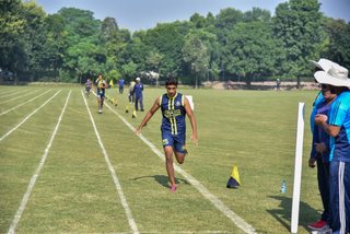 Aitchison Dominates First Day's Athletics Against Lawrence