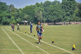 Aitchison Dominates First Day's Athletics Against Lawrence
