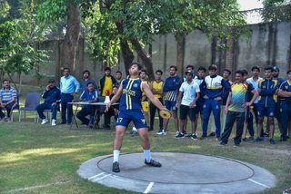 Aitchison Dominates First Day's Athletics Against Lawrence