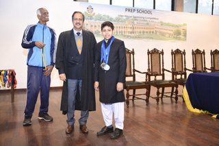 Headmaster of Prep School Awards Swimming Prizes