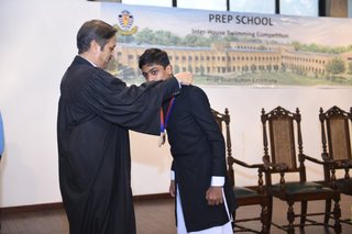 Headmaster of Prep School Awards Swimming Prizes