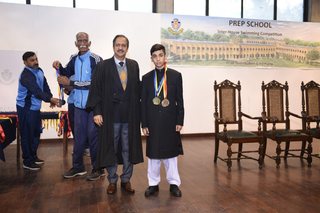 Headmaster of Prep School Awards Swimming Prizes