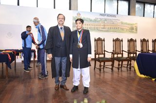 Headmaster of Prep School Awards Swimming Prizes