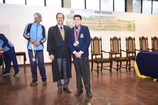 Headmaster of Prep School Awards Swimming Prizes