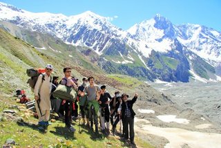 Shahid Mahmood Aslam pointing out the landscape to our boys on their trekking from Nalter Valley to Ishkoman Valley, June 26th to July 6th. Glorious Pakistan.