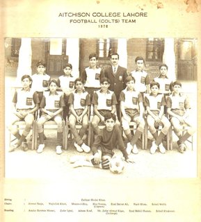 1970 - Aitchison College Football (Colts) Team 1970. Sitting: Zulfiqar Haider Khan Chairs: Ahmad Shuja, Wajiullah Khan, Moeen-ul-Haq, Haq Nawaz (Captain), Syed Imtiaz Ali, Nasir Khan, Sohail Malik. Standing: Asadur Rehman Mazari, Zafar Iqbal, Adnan Rauf, Mr. Zafar Ahmad Khan (Incharge), Syed Mehdi Hassan, Sohail Khakwani.