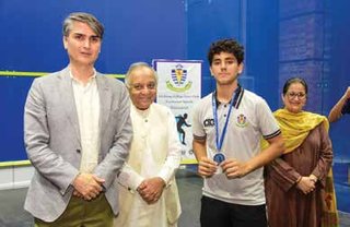 Sakhi Ullah Khan Tareen receiving a medal from Dr. Syed Turab Hussain (Principal) along with Mr. Shahjahan Ayub (FMR ACOBA President) and Ms. Amina Kamran (HMSS).