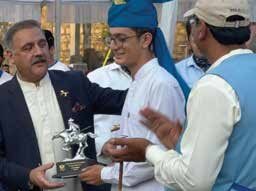 Ch-Ibrahim Tahir Farooq (AC, 2024) while receiving the silver medal.